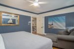 Upstairs king bedroom has a nautical theme
